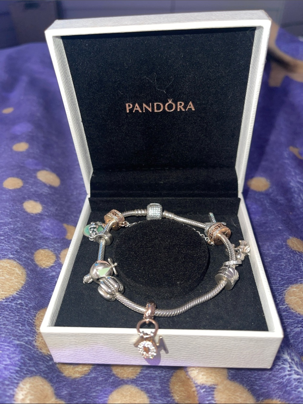 Pandora Silver Charm Bracelet w/gold accents.